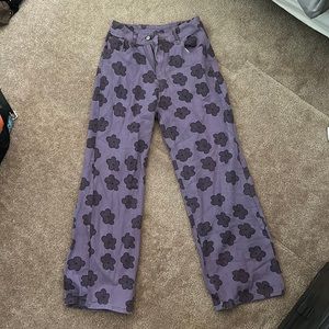 High wasted, purple flower jeans. Wide leg. Size small.
